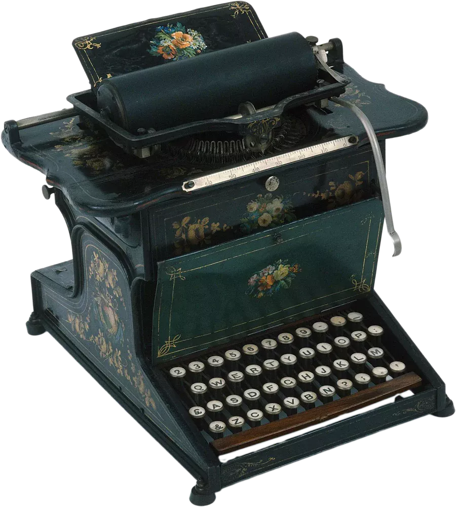 Historical typewriter “Sholes & Glidden Type-Writer” of 1874: black, hand-painted casing with floral ornaments, green flap, round white keys in four rows